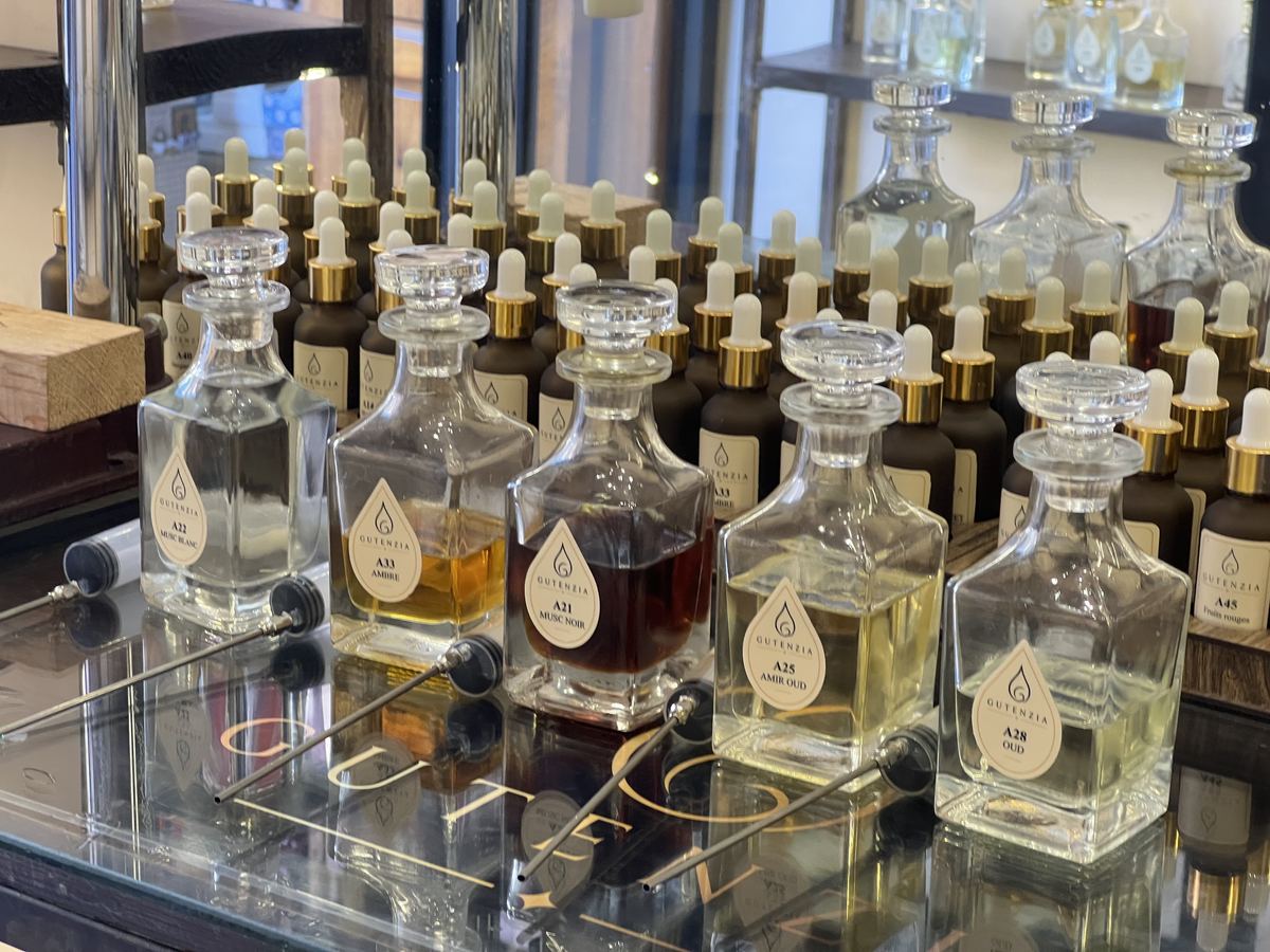 Essence decanters on the counter of the GUTENZIA perfume making workshop, Marrakech Medina